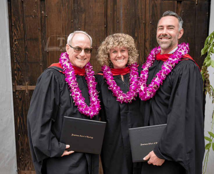 Most recent Alumni Picture. In their Graduation Gowns. 