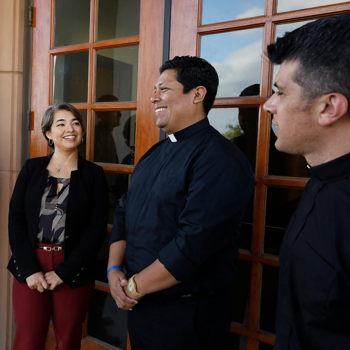 happy student talking to faculty