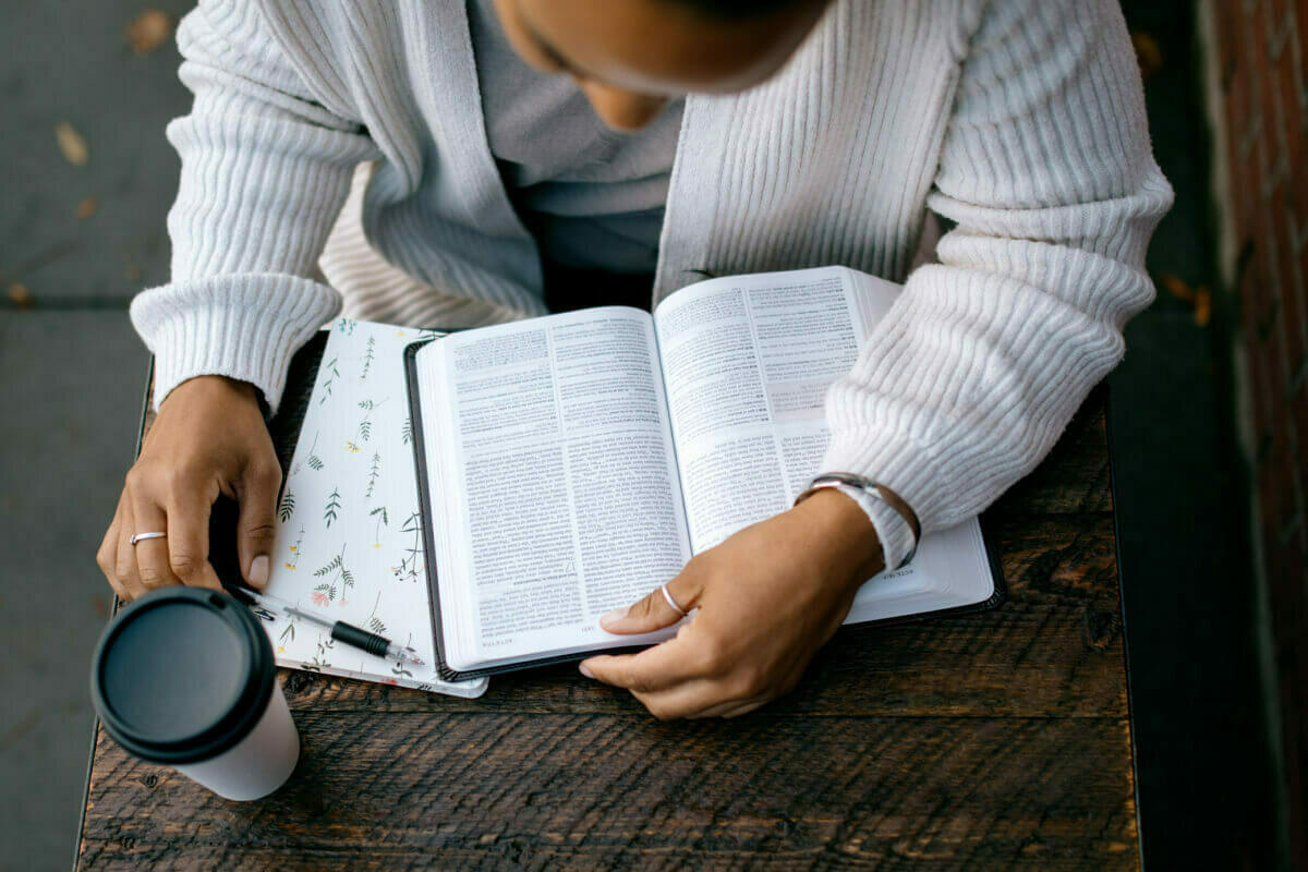 Women reading a bible at a table